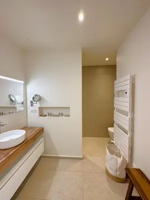 a bathroom with a sink and a toilet at Villa Alba Di Pinarello in Pinarellu
