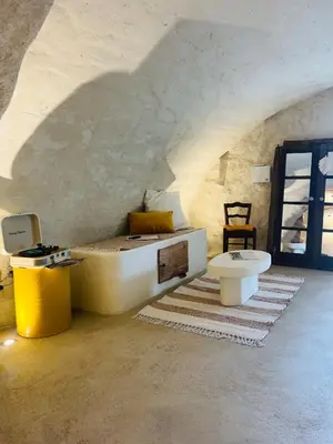 a bathroom with a tub and a toilet in a room at Charming house with sea view Emily in Porri in Porri