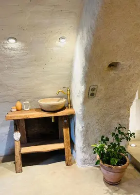a bathroom with a sink on a wooden table at Charming house with sea view Emily in Porri in Porri