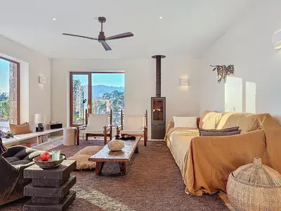 a living room with a couch and a table at Villa Sabbia in Lecci
