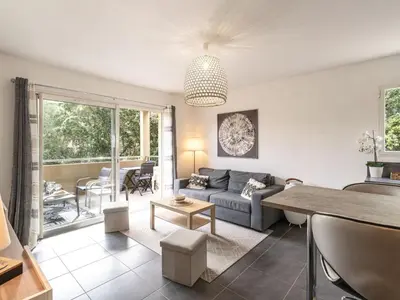 a living room with a couch and a table at Apartment Clos Vignola by Interhome in Porto-Vecchio