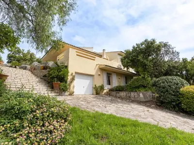 a house with a driveway in front of it at Holiday Home Villa Marina by Interhome in Porto-Vecchio