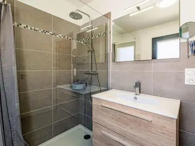 a bathroom with a sink and a shower at Apartment Foce Dell Edera-3 by Interhome in Bonifacio