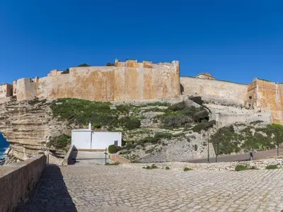 a large castle on the side of a cliff at Apartment Foce Dell Edera-3 by Interhome in Bonifacio