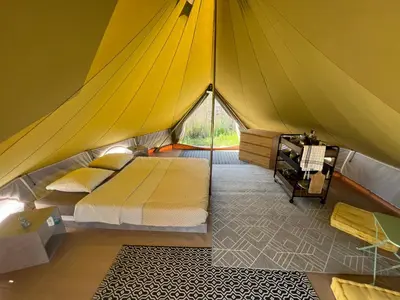 a bedroom in a tent with a bed in it at Le Tipi in Lecci