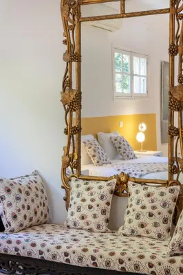 a bedroom with two beds and a mirror at Balamb Garden A Cinarchesa in Ajaccio