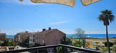 a view of the ocean from a balcony at Palmeraie 131-Clim-PISCINE EN RESIDENCE in Sari Solenzara
