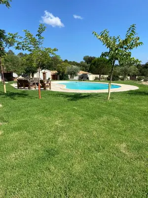 a swimming pool in the middle of a yard at T2 bala in Porto-Vecchio