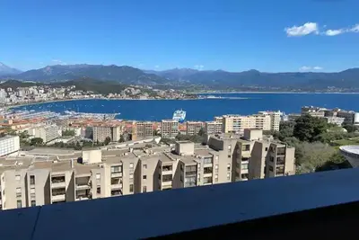 a view of a city with buildings and a body of water at Salario-1 in Ajaccio