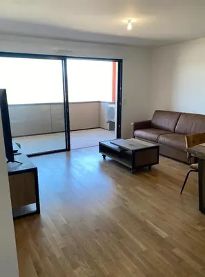 a living room with a couch and a coffee table at Salario-1 in Ajaccio