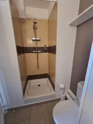 a bathroom with a shower and a toilet at Beau Studio vue sur mer, route des sanguinaires in Ajaccio