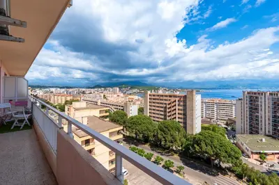 a balcony with a view of a city at Le Renoso - Climatisé vue mer et montagne in Ajaccio