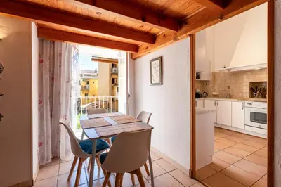 a kitchen and dining room with a table and chairs at Appartement cosy - Hyper centre-ville in Ajaccio