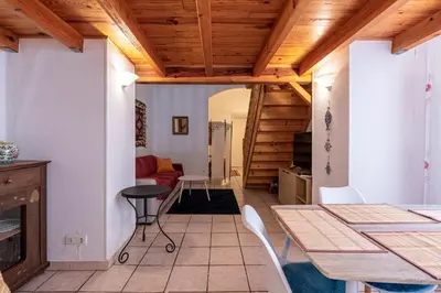 a room with a table and chairs and a living room at Appartement cosy - Hyper centre-ville in Ajaccio