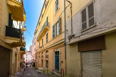 an alley between two buildings in a city at Appartement cosy - Hyper centre-ville in Ajaccio