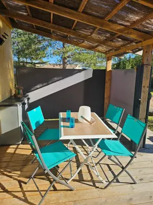 a table and four chairs on a patio at Studio Villa Boca in Prunelli-di-Fiumorbo