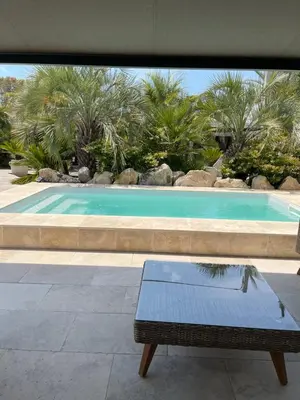 a bench sitting in front of a swimming pool at Casa Di Lortu villa in Ajaccio