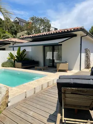 a villa with a swimming pool and a house at Casa Di Lortu villa in Ajaccio