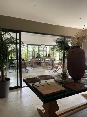 a living room with a table and a large vase at Casa Di Lortu villa in Ajaccio