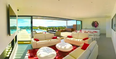 a living room with couches and a table and a pool at Villa Isulana, piscine chauffée, vue mer, proche Pinarello in Zonza