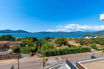 a view of a street and a lake at A Sereina - appt climatisé proche de la plage in Grosseto-Prugna