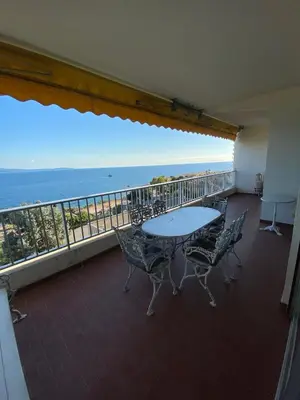 a balcony with a table and chairs and the ocean at Maria - 3BR Terrace Panoramic sea view - by TGB in Ajaccio