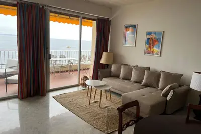a living room with a couch and a view of the ocean at Maria - 3BR Terrace Panoramic sea view - by TGB in Ajaccio