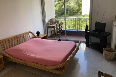 a bedroom with a bed with a pink blanket at Maria - 3BR Terrace Panoramic sea view - by TGB in Ajaccio