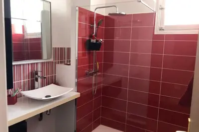 a bathroom with a red tiled shower with a sink at Maria - 3BR Terrace Panoramic sea view - by TGB in Ajaccio