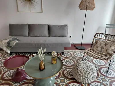 a living room with a couch and a table at U Casone in Aléria