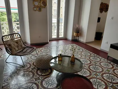 a living room with a glass table and chairs at U Casone in Aléria
