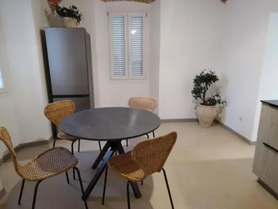 a dining room with a table and chairs at U Casone in Aléria