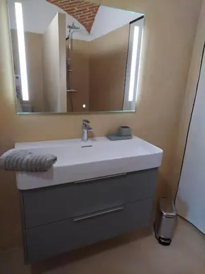 a bathroom with a sink and a mirror at U Casone in Aléria