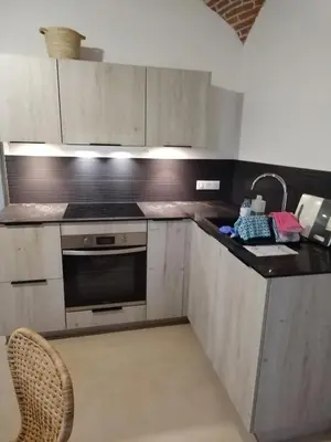 a kitchen with a stove and a sink in it at U Casone in Aléria