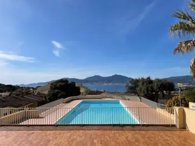 a swimming pool with a view of the water at Charmant 2 pièces avec vue sur mer exceptionnelle à Porticcio, Corse du Sud in Grosseto-Prugna