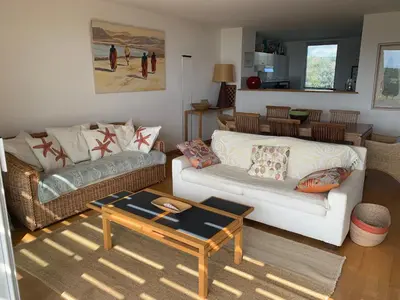 a living room with a couch and a coffee table at Bonifacio accès mer et golf - vue exceptionnelle in Bonifacio