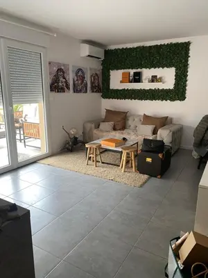 a living room with a couch and a table at Porticcio Agosta in Albitreccia
