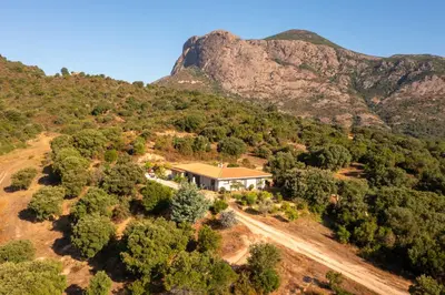 an aerial view of a house on a mountain at Gozzi Mandriolu in Afa