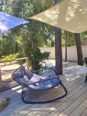 a living room with a couch and a table at Villa à Lecci in Lecci