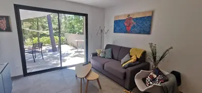 a living room with a tv and a wall at Villa à Lecci in Lecci