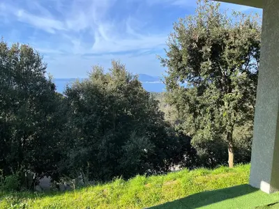 a view of a field with trees in the background at RANDOS à 15 mn de la plage COTI CHIAVARI Vue exceptionnelle Appart indépendant 3 ch in Coti-Chiavari