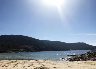 a beach with a body of water and a mountain at Spacieuse villa avec vue exceptionnelle in Piana