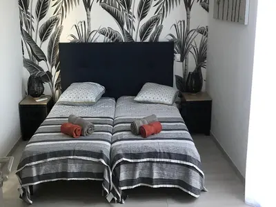 a bed with two pillows on it in a room at Appartement T3 L'Astragale - Classé 3 étoiles Tourisme in Lecci