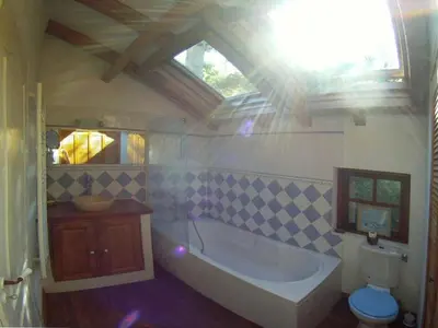 a bathroom with a tub and a sink and a toilet at Holiday Apartment Segura 2 in Oletta
