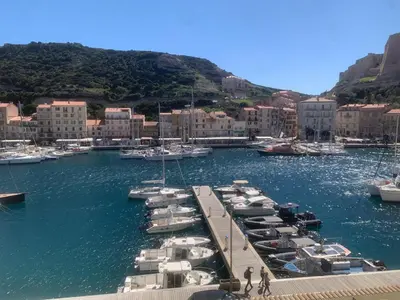 a bunch of boats are docked in a harbor at L'Ancrage - TV, Vue sur le port, Wi-Fi in Bonifacio