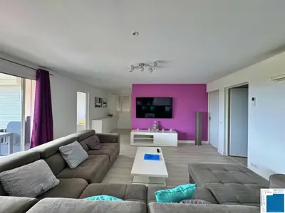 a living room with a couch and a tv at VILLA GIULIA - Piscine - Jacuzzi - 4 Chambres in Porto-Vecchio
