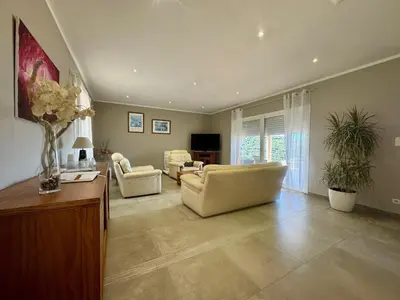 a living room with two couches and a television at Gîte Inseme, le calme entre mer et montagne en Corse in Arbellara