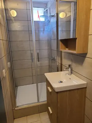a bathroom with a shower and a sink at Casinu - Casino in San-Nicolao