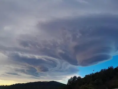 a cloud formation in the sky over a mountain at La Ferme Du Maquis in Antisanti