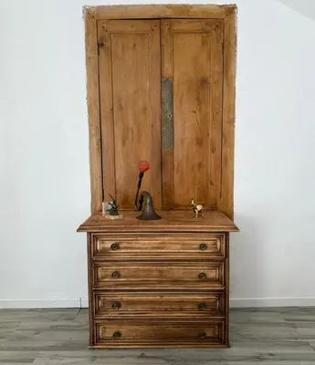 a wooden dresser with a lamp on top of it at Tour avec rooftop, vue mer, séjour insolite entre ciel et mer in Porri